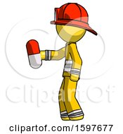 Yellow Firefighter Fireman Man Holding Red Pill Walking To Left