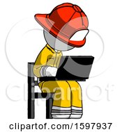 Poster, Art Print Of White Firefighter Fireman Man Using Laptop Computer While Sitting In Chair Angled Right