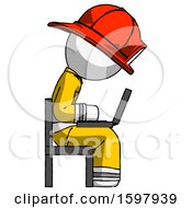 Poster, Art Print Of White Firefighter Fireman Man Using Laptop Computer While Sitting In Chair View From Side