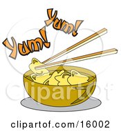 Chopsticks Lifting Food Out Of A Bowl Of Won Ton Soup