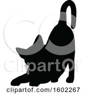 Clipart Of A Black Silhouetted Cat Stretching Royalty Free Vector Illustration