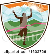 Clipart Of A Silhouetted Male Marathon Runner Breaking Through The Finish Line In A Shield Against A Snow Capped Mountainous Sunset Royalty Free Vector Illustration