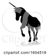 Clipart Of A Black Silhouetted Unicorn Horse With A Reflection Or Shadow On A White Background Royalty Free Vector Illustration