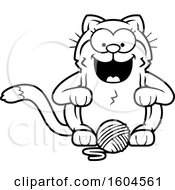 Clipart Of A Cartoon Black And White Kitty Cat With A Ball Of Yarn Royalty Free Vector Illustration