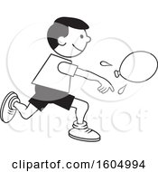 Boy Throwing A Water Balloon On Field Day