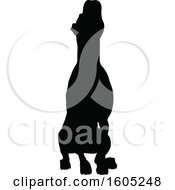 Clipart Of A Black Silhouetted Dog Sitting Royalty Free Vector Illustration