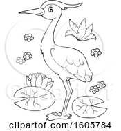 Clipart Of A Black And White Heron Bird With Lily Pads Royalty Free Vector Illustration
