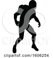 Clipart Of A Silhouetted Football Player Royalty Free Vector Illustration by AtStockIllustration