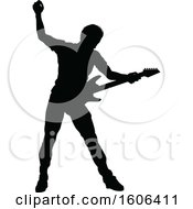 Clipart Of A Silhouetted Male Guitarist Royalty Free Vector Illustration