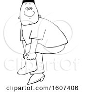 Clipart Of A Cartoon Lineart Black Male Slipping On A Boot Cover Royalty Free Vector Illustration