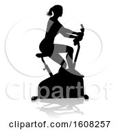 Silhouetted Woman Working Out And Exercising On A Stationary Bike With A Shadow On A White Bcakground