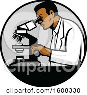 Black Male Scientist Using A Microscope In A Laboratory