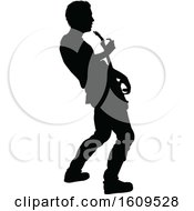 Clipart Of A Silhouetted Male Guitarist Royalty Free Vector Illustration by AtStockIllustration