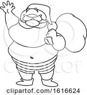 Clipart Of A Black And White Santa On A Beach Royalty Free Vector Illustration