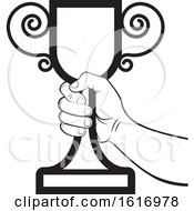 Clipart Of A Black And White Hand Holding A Trophy Cup Royalty Free Vector Illustration