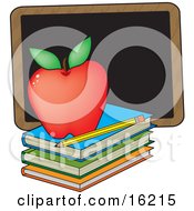 Poster, Art Print Of Perfect Red Apple Sitting On Top Of A Stack Of School Books Near A Pencil And Chalkboard On A Teachers Desk