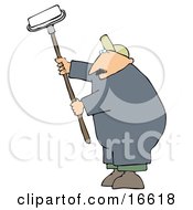 Middle Aged Caucasian Man Using A Paint Roller While Painting A Building