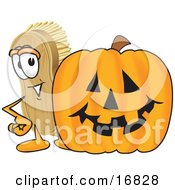 Scrub Brush Mascot Cartoon Character Standing By A Carved Halloween Pumpkin