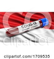 Flag Of Monaco Waving In The Wind With A Positive Covid19 Blood Test Tube