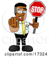 Black Businessman Mascot Cartoon Character Holding A Stop Sign