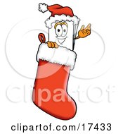Clipart Picture Of A Paper Mascot Cartoon Character Wearing A Santa Hat Inside A Red Christmas Stocking