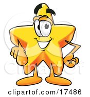 Clipart Picture Of A Star Mascot Cartoon Character Pointing At The Viewer by Toons4Biz