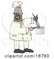 Black Male Chef Stirring Food In A Pot With A Whisk