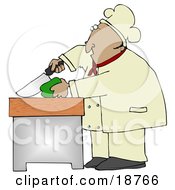 Mexican Male Chef Carefully Slicing A Green Bell Pepper