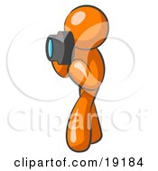 Clipart Illustration Of An Orange Man Character Tourist Or Photographer Taking Pictures With A Camera