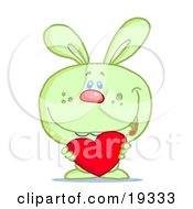 Clipart Illustration Of A Cute Green Rabbit Holding A Red Heart Valentine