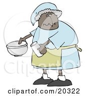 Black Lady In A Green Apron Putting Ingredients In A Mixing Bowl While Baking In A Kitchen