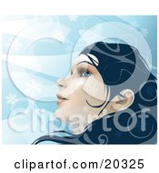 Poster, Art Print Of Young Beautiful Caucasian Woman With Blue Eyes And Dark Hair Looking Up At The Wintry Sky As Snowflakes Fall Around Her Face