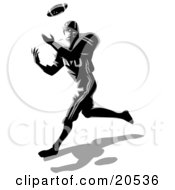 Poster, Art Print Of Athletic American Football Player Catching A Ball During A Game