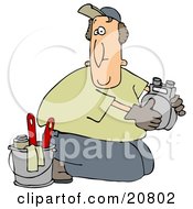 Kneeling Gas Meter Man From The Gas Company Installing Or Repairing A Meter