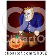 Frankenstein Looking Down At A Glowing Jack O Lantern Pumpkin