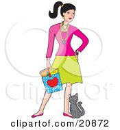 Young Caucasian Woman Holding A Shopping Bag And Standing With A Cat Rubbing Against Her Leg