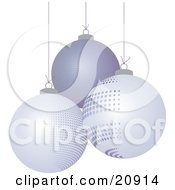 Three Different Suspended Off White And Purple Christmas Bauble Ornaments Over A White Background by elaineitalia