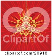 Poster, Art Print Of Shiny Golden Snowflake Christmas Tree Ornament Suspended By A Chain Over A Red Background