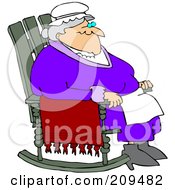 Relaxed Old Woman Sitting In A Rocking Chair