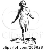Retro Black And White Woman Running In The Ocean Surf At The Beach