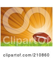 Poster, Art Print Of Football Resting On Grass Against A Bursting Orange Background