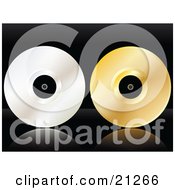 Platinum And Gold Vinyl Record Discs On A Black Reflective Surface by elaineitalia
