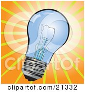 Poster, Art Print Of Clear Glass Electric Lightbulb Over A Bright Orange And Yellow Background