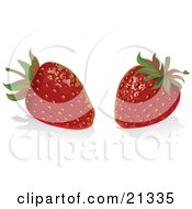 Two Ripe Red Strawberries Resting On A White Reflective Counter