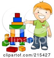 Little School Boy Building With Blocks