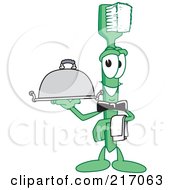 Green Toothbrush Character Mascot Serving A Platter