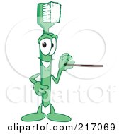 Green Toothbrush Character Mascot Using A Pointer Stick