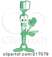 Royalty Free RF Clipart Illustration Of A Green Toothbrush Character Mascot Waving And Pointing by Mascot Junction