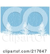 Blue Background Of Snow Falling On Bare Trees
