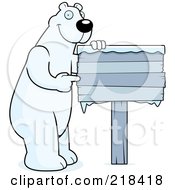 Poster, Art Print Of Big Polar Bear Standing And Pointing To A Frozen Wood Sign